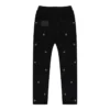 Pantaloni da tuta con occhielli multipli