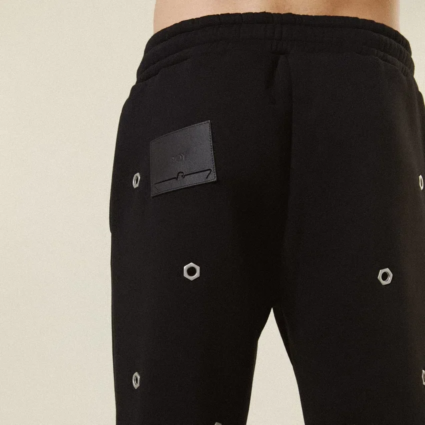 Pantaloni da tuta con occhielli multipli