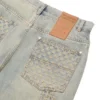 Pantaloni in denim con effetto consumato al laser